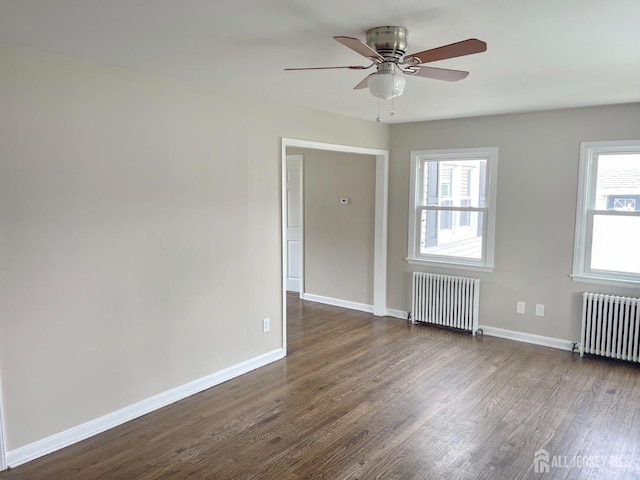 66 W Spring St W, Somerville, NJ 08876 - empty room with radiator heating unit, dark wood finished floors, and baseboards