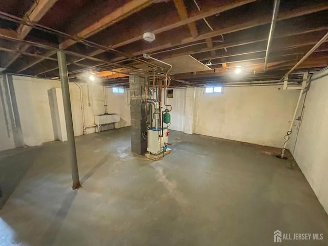 66 W Spring St W, Somerville, NJ 08876 - basement featuring a sink and a heating unit