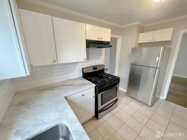 66 W Spring St W, Somerville, NJ 08876 - kitchen with stainless steel appliances, under cabinet range hood, white cabinets, decorative backsplash, and ornamental molding