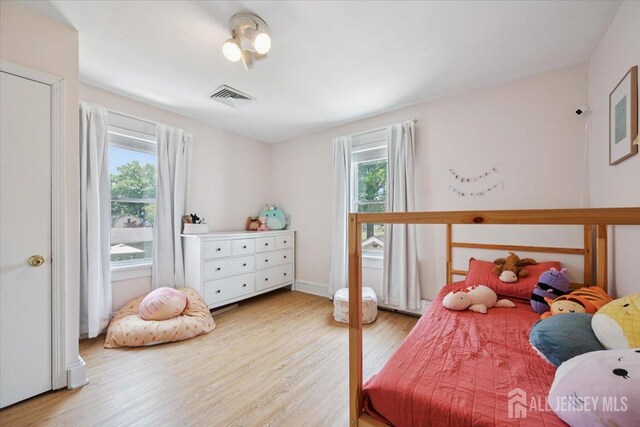 60 S St S, Milltown, NJ 08850 - bedroom with multiple windows and wood finished floors