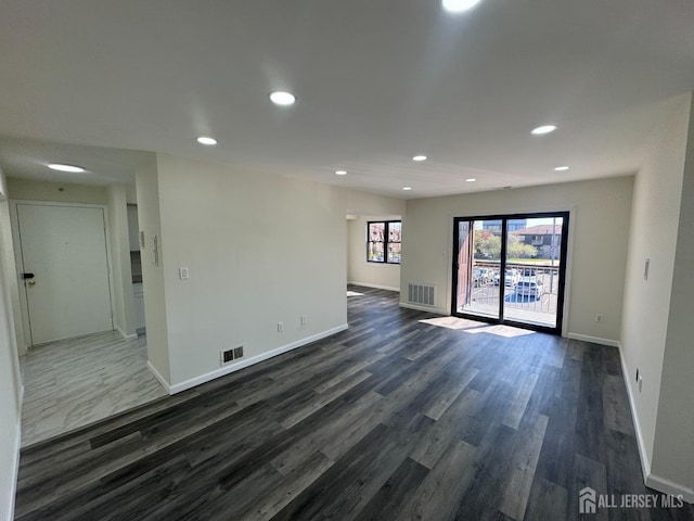 89 Golden Sq, Woodbridge Proper, NJ 07095 - empty room with dark wood finished floors and recessed lighting