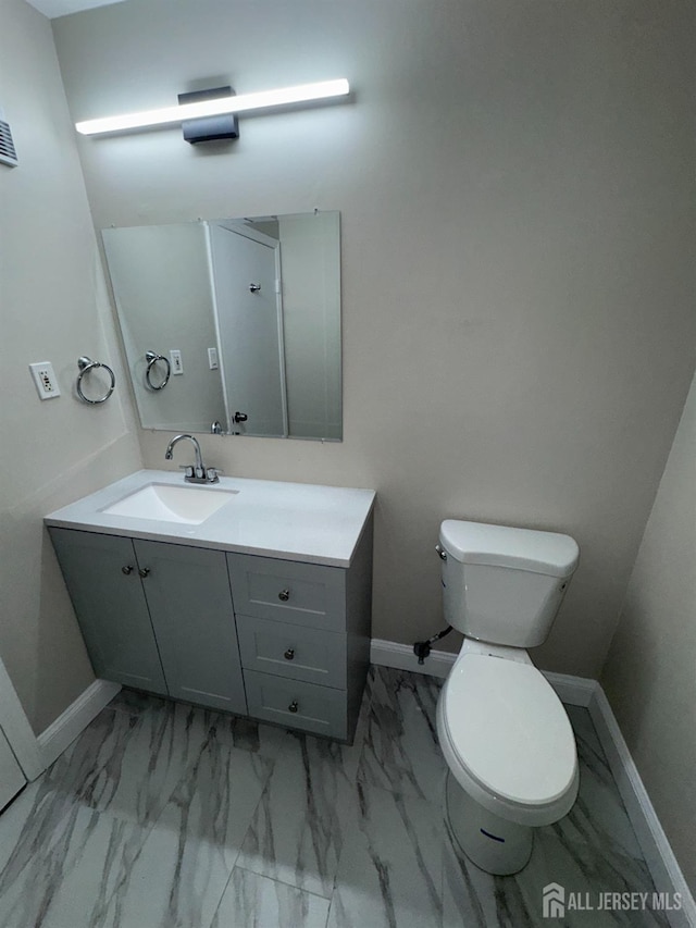 89 Golden Sq, Woodbridge Proper, NJ 07095 - half bathroom featuring vanity and marble finish floors