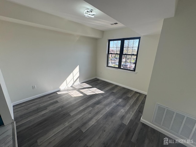 89 Golden Sq, Woodbridge Proper, NJ 07095 - spare room featuring dark wood-style floors and baseboards