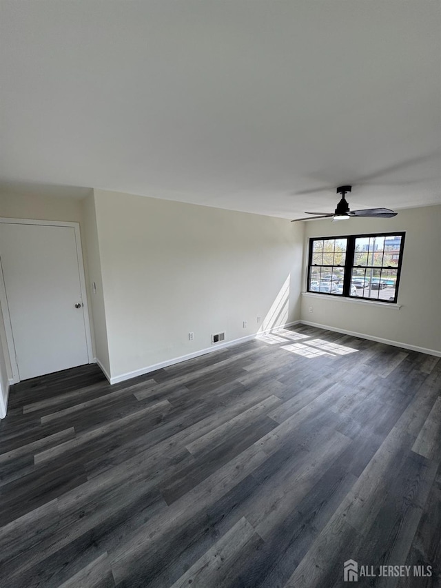 89 Golden Sq, Woodbridge Proper, NJ 07095 - spare room with dark wood-style flooring and ceiling fan