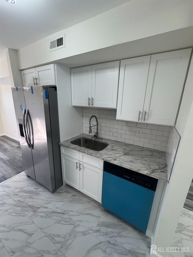 89 Golden Sq, Woodbridge Proper, NJ 07095 - kitchen with dishwashing machine, stainless steel fridge with ice dispenser, light marble finish floors, white cabinets, and light stone countertops