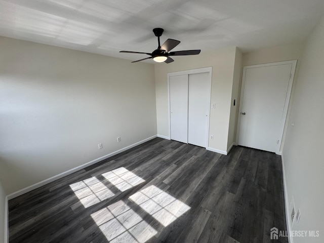 89 Golden Sq, Woodbridge Proper, NJ 07095 - unfurnished bedroom featuring dark wood-type flooring, a closet, and a ceiling fan