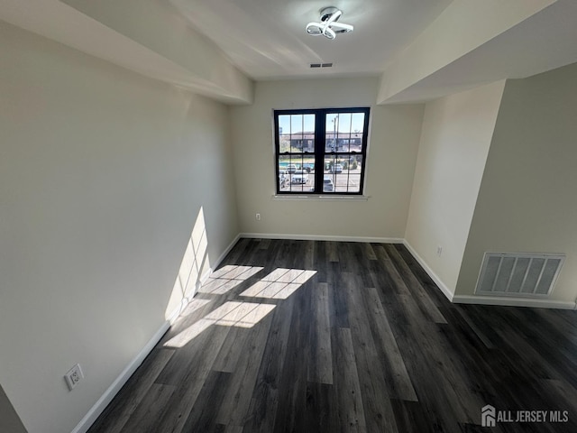 89 Golden Sq, Woodbridge Proper, NJ 07095 - empty room with dark wood-style flooring and baseboards