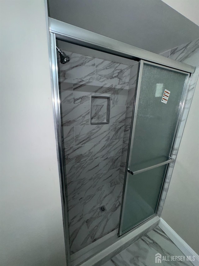 89 Golden Sq, Woodbridge Proper, NJ 07095 - bathroom featuring marble look tile flooring and a stall shower