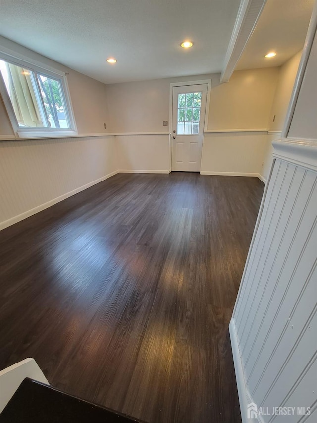 unfurnished room featuring dark hardwood / wood-style floors