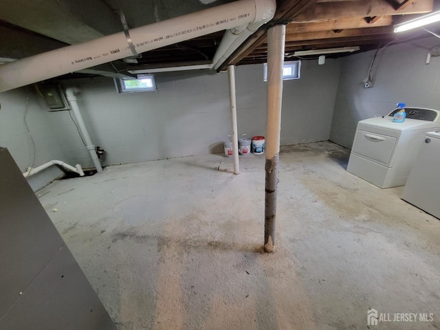 basement with independent washer and dryer and a healthy amount of sunlight