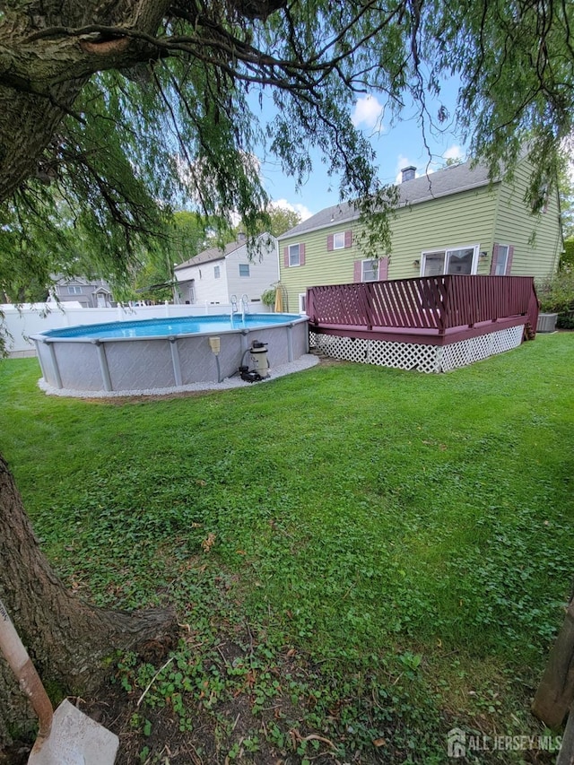 view of yard featuring a pool side deck