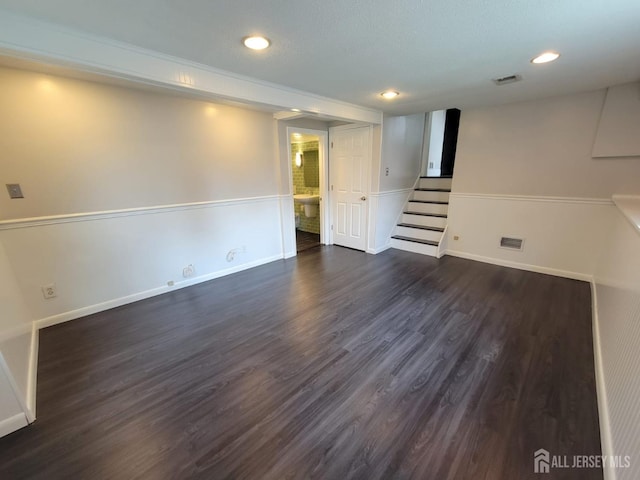 basement featuring dark hardwood / wood-style flooring