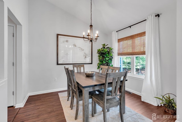 43 Capica Ct, South Amboy, NJ 08879 - dining room with a chandelier, dark wood-style flooring, and vaulted ceiling