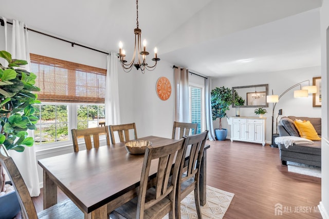 43 Capica Ct, South Amboy, NJ 08879 - dining area with dark wood-type flooring and a chandelier