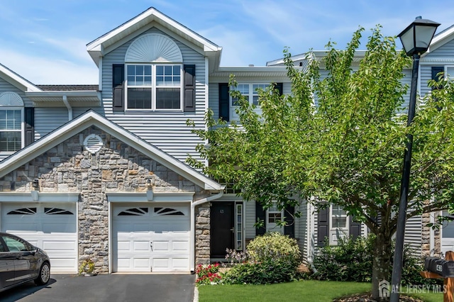 43 Capica Ct, South Amboy, NJ 08879 - view of front of house with stone siding and driveway