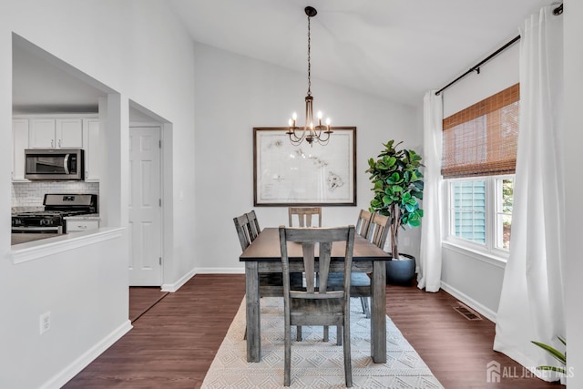 43 Capica Ct, South Amboy, NJ 08879 - dining area featuring lofted ceiling, a chandelier, and dark wood finished floors