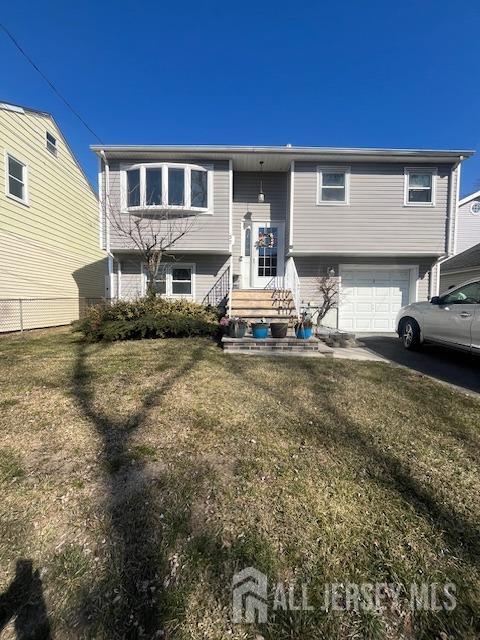 37 Kearney Ave, Keyport, NJ 07735 - split foyer home featuring a garage and asphalt driveway