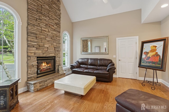 7 Pershing Ct, North Brunswick, NJ 08902 - living area featuring wood finished floors, a fireplace, high vaulted ceiling, and ceiling fan
