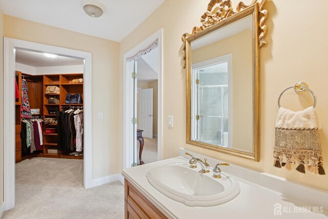 7 Pershing Ct, North Brunswick, NJ 08902 - full bath with vanity, a shower with door, and a spacious closet