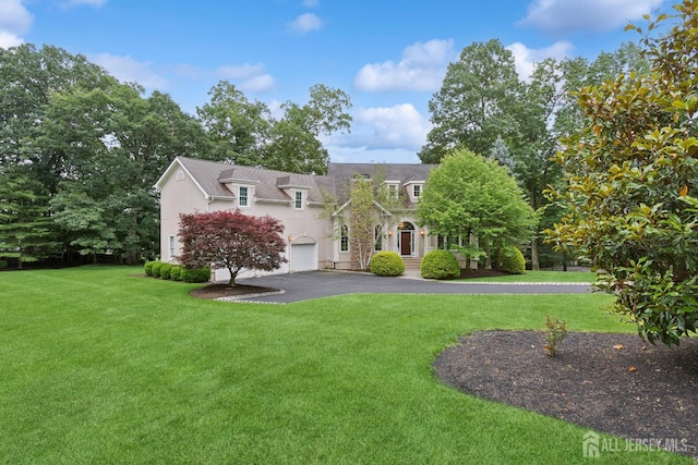 7 Pershing Ct, North Brunswick, NJ 08902 - view of front of home with asphalt driveway, a front yard, and an attached garage