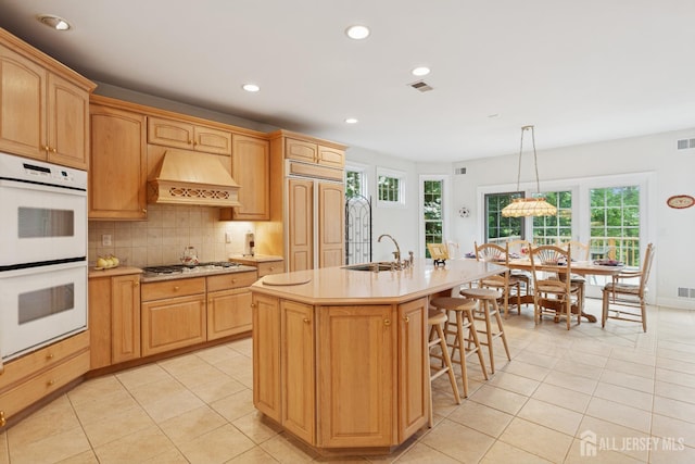 7 Pershing Ct, North Brunswick, NJ 08902 - kitchen featuring white double oven, custom exhaust hood, light tile patterned flooring, light countertops, and recessed lighting