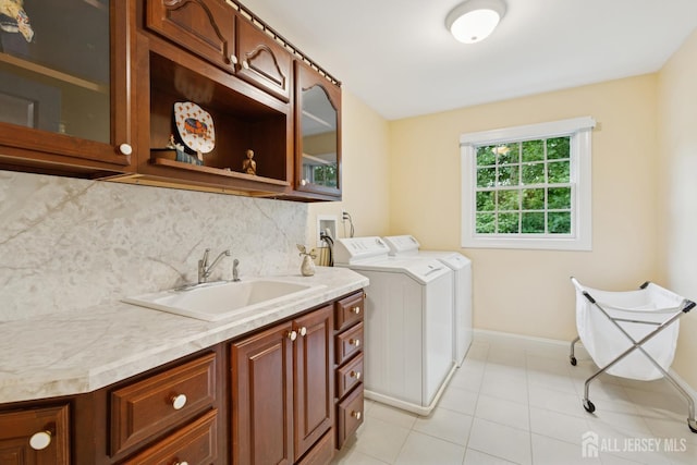 7 Pershing Ct, North Brunswick, NJ 08902 - laundry room with washer and clothes dryer, cabinet space, and light tile patterned floors