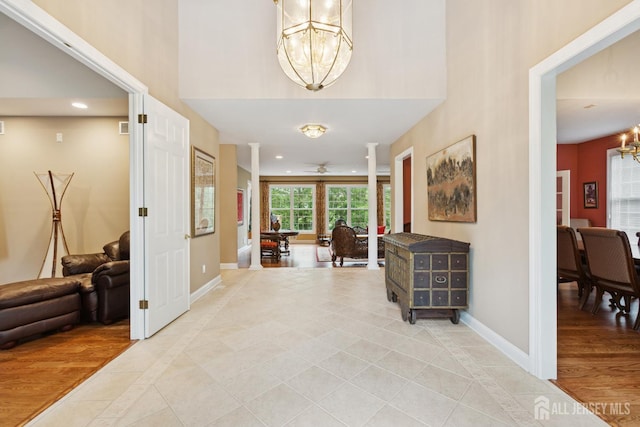 7 Pershing Ct, North Brunswick, NJ 08902 - foyer featuring a chandelier, inlaid floor details, recessed lighting, light tile patterned flooring, and a high ceiling