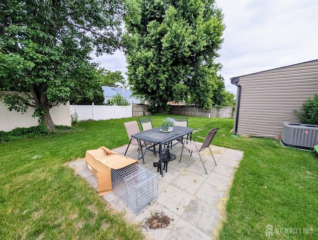 23 Orchard Dr, Old Bridge, NJ 08857 - view of patio featuring central air condition unit and outdoor dining area