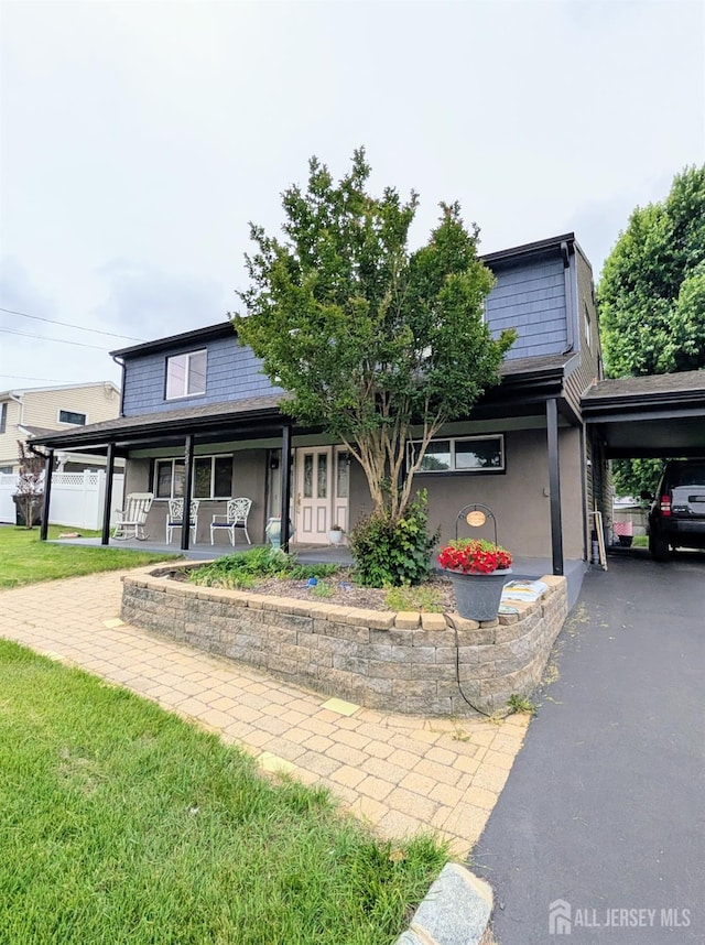 23 Orchard Dr, Old Bridge, NJ 08857 - view of front of home featuring a porch and stucco siding