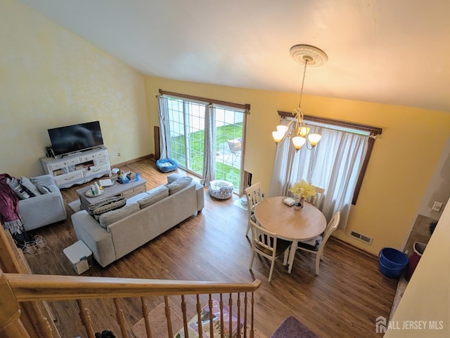 23 Orchard Dr, Old Bridge, NJ 08857 - living room featuring wood finished floors, a chandelier, and baseboards