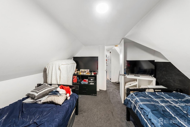 carpeted bedroom featuring vaulted ceiling