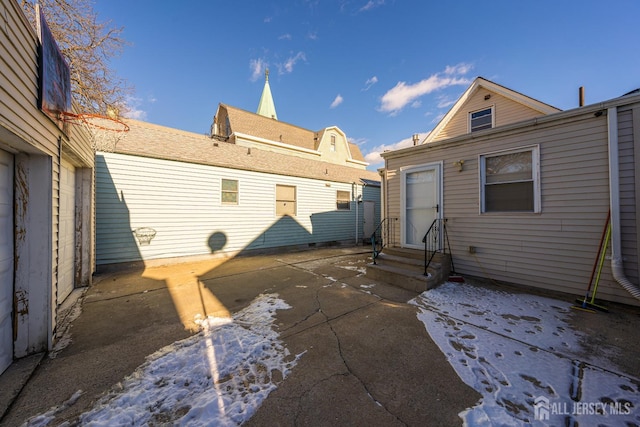 rear view of property with a patio and entry steps