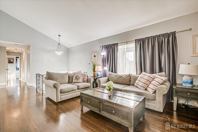 12 Sherry Rd, East Brunswick, NJ 08816 - living area with dark wood finished floors, baseboards, and high vaulted ceiling