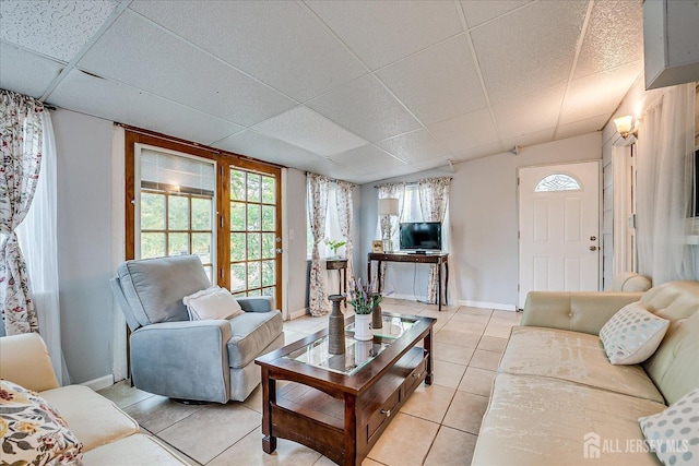 12 Sherry Rd, East Brunswick, NJ 08816 - living room with light tile patterned floors, baseboards, and a paneled ceiling