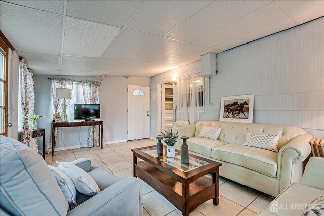 12 Sherry Rd, East Brunswick, NJ 08816 - tiled living area featuring a drop ceiling and baseboards