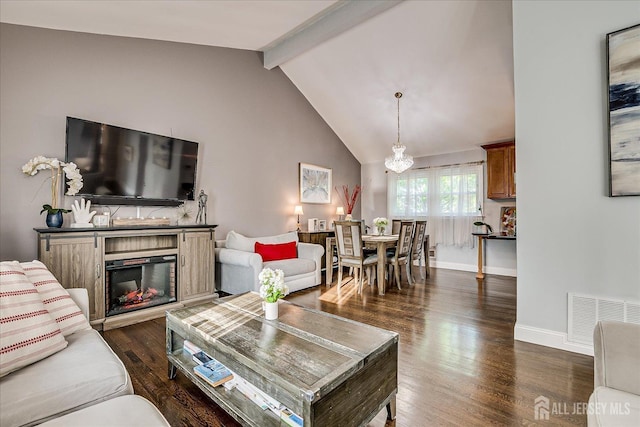 12 Sherry Rd, East Brunswick, NJ 08816 - living area with dark wood-style floors, baseboards, and a glass covered fireplace