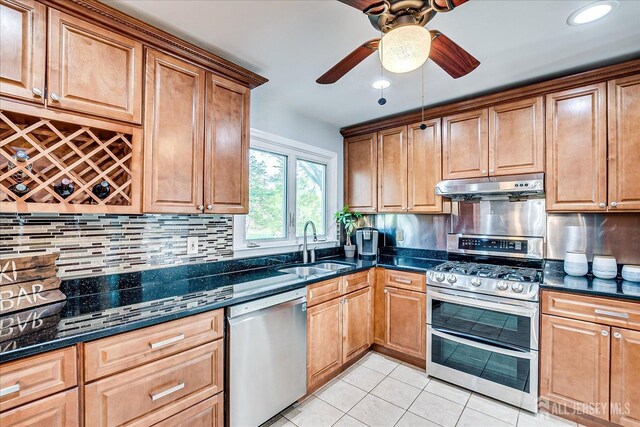 12 Sherry Rd, East Brunswick, NJ 08816 - kitchen with stainless steel appliances, under cabinet range hood, a sink, ceiling fan, and light tile patterned floors
