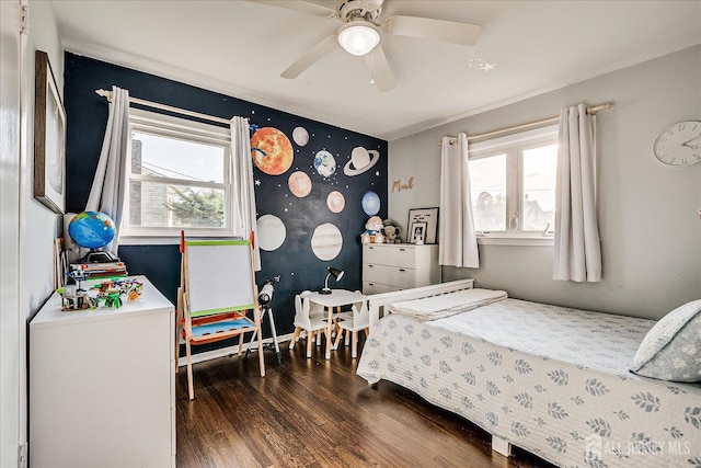 bedroom with wood finished floors and ceiling fan