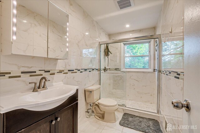 12 Sherry Rd, East Brunswick, NJ 08816 - full bath with a shower stall, tile walls, toilet, and vanity