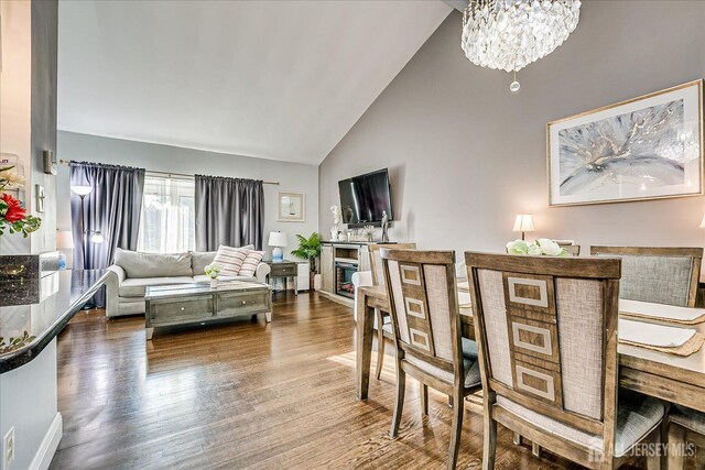 12 Sherry Rd, East Brunswick, NJ 08816 - dining room with wood finished floors, high vaulted ceiling, and a chandelier