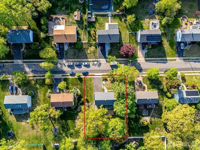 aerial view of residential area featuring property parcel outlined