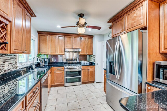 12 Sherry Rd, East Brunswick, NJ 08816 - kitchen with stainless steel appliances, a sink, under cabinet range hood, backsplash, and ceiling fan
