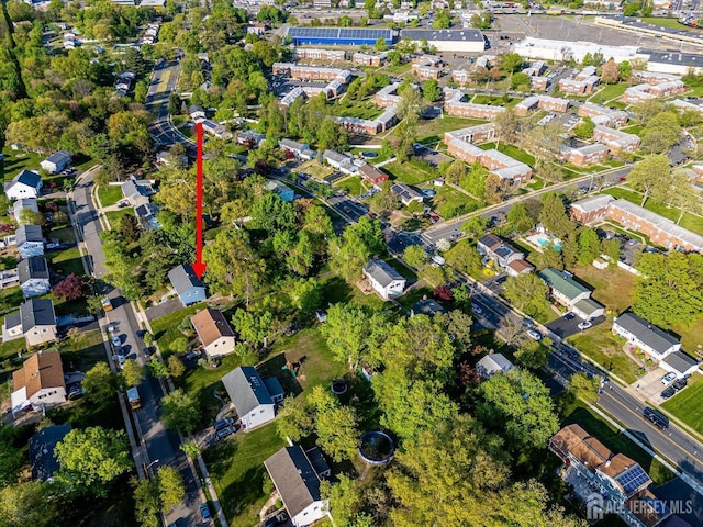 aerial overview of property's location with nearby suburban area