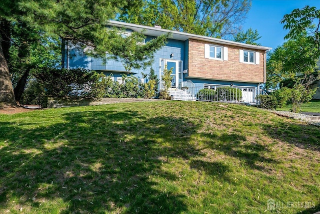 12 Sherry Rd, East Brunswick, NJ 08816 - bi-level home with a front lawn and stone siding