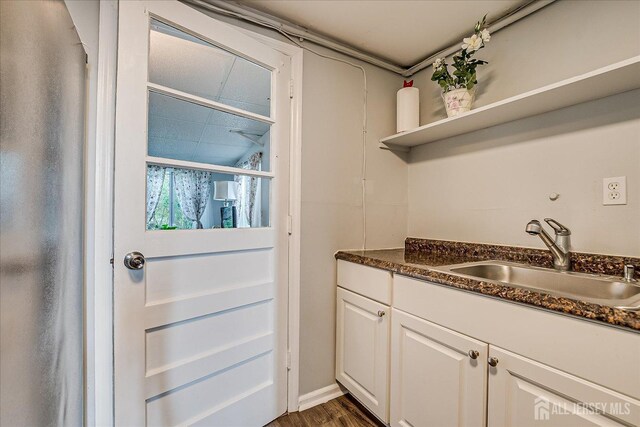 12 Sherry Rd, East Brunswick, NJ 08816 - kitchen with a sink, open shelves, white cabinets, and dark wood-style floors