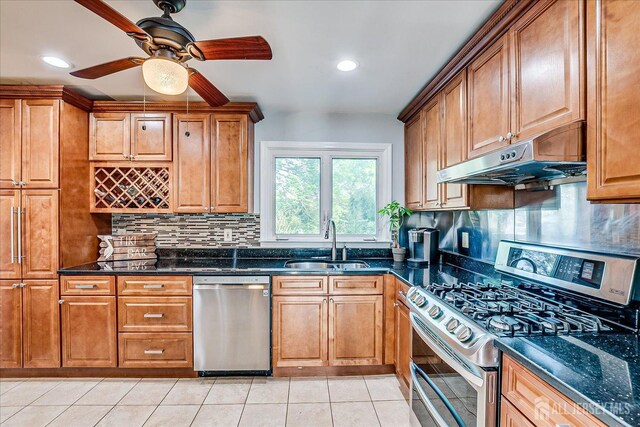 12 Sherry Rd, East Brunswick, NJ 08816 - kitchen with appliances with stainless steel finishes, under cabinet range hood, a sink, tasteful backsplash, and recessed lighting