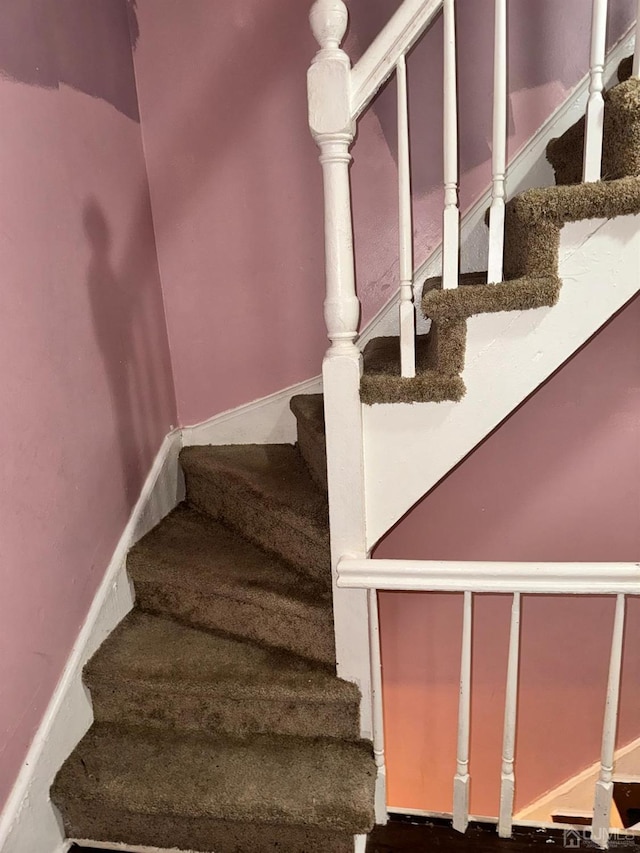 stairway with baseboards