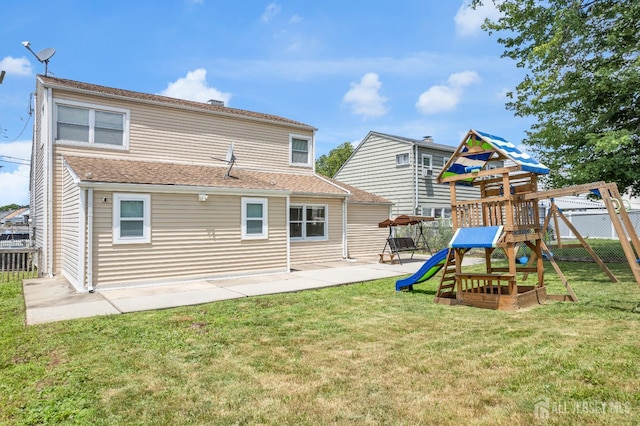 186 Tyler Ave, Iselin, NJ 08830 - rear view of property featuring a playground and a patio area