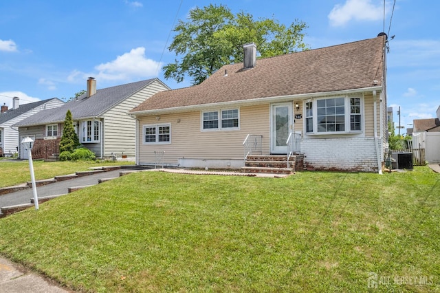 186 Tyler Ave, Iselin, NJ 08830 - view of front of property with a front lawn and a chimney