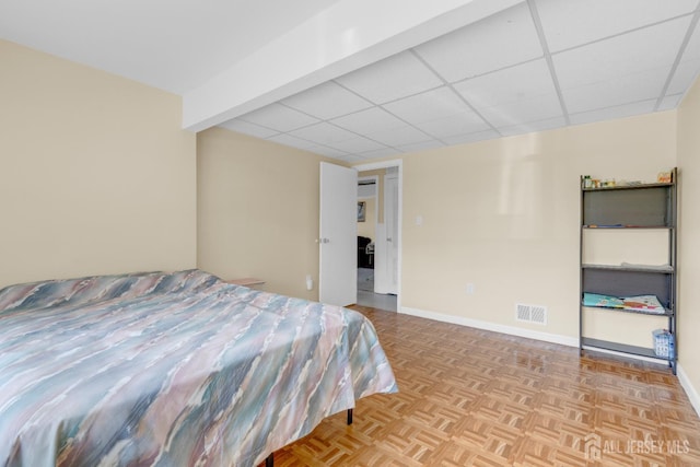 186 Tyler Ave, Iselin, NJ 08830 - bedroom with baseboards and a drop ceiling